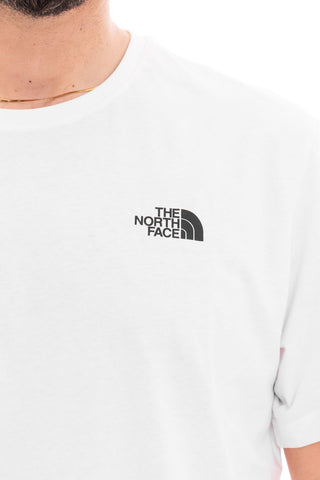 THE NORTH FACE T-SHIRT SHORT SLEEVES REDBOX CELEBRATION UOMO NF0A87NVFN4